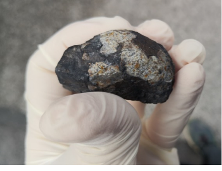 A 48-gram piece of the Novo Mesto meteorite. Credit: Bojan Ambrožič (Center of Excellence on Nanoscience and Nanotechnology, Slovenia and https://bojanambrozic.com/).