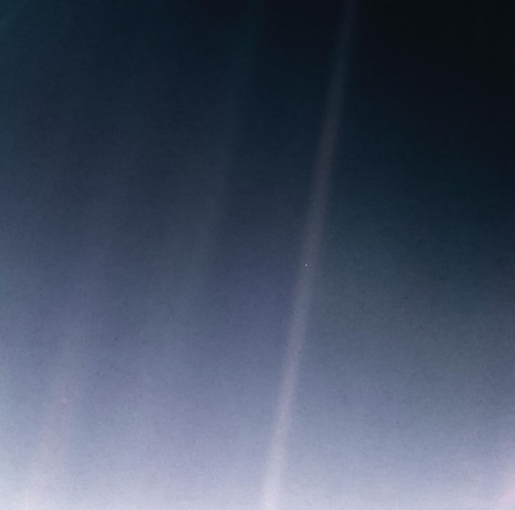 Image showing the Earth from a distance of 6 billion kilometres, taken by the NASA Voyager 1 spacecraft in 1990. It has become iconic as the “pale blue dot”.