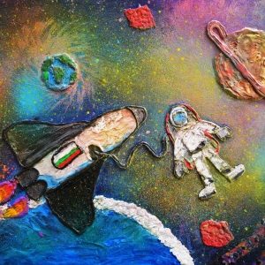 The beauty of space through children&#039;s eyes. Credit: Katerina Kemurdzhieva. In my work of art, I have drawn an astronaut floating in beautiful space with his rocket. In the foreground is the planet Uranus, and behind it in the distance stand out in all its glory the sixth planet in the solar system - Saturn and of course our planet - Earth. To make my drawing, I used a technique of overlaying plasticine and complementing the spaces between the figures with iridescent colors of tempera paints. I used colorless varnish to seal the surface and for an additional visual effect. My idea is to try to recreate my vision of people&#039;s encounter with the cosmos, of the magic of celestial bodies and phenomena, of the constant attempts that people make to study the universe.